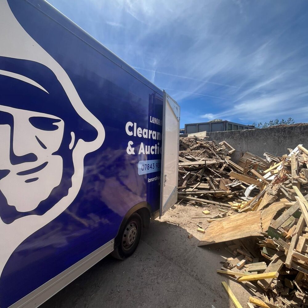 Lanora House van beside a pile of timber at the wood recycling facility