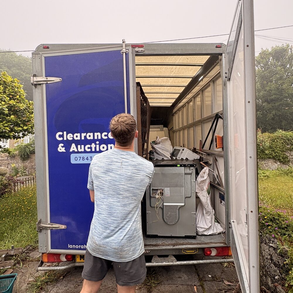 Matt from Lanora House sorting items at the van during a clearance