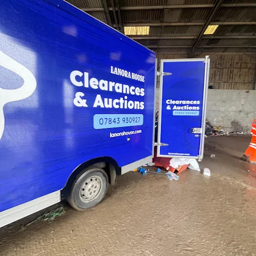 Lanora House clearance van and trailer unloading inside a waste transfer station
